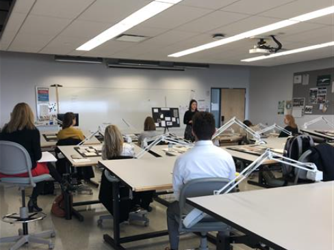 Students sitting at drafting tables.