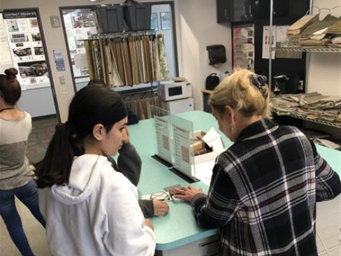 Discussing fabric selections.